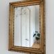 Antique French giltwood wall mirror in gold