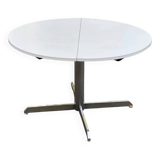 White dining table with a central pedestal, extendable, from the 1970s.