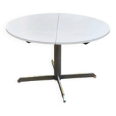 White dining table with a central pedestal, extendable, from the 1970s.