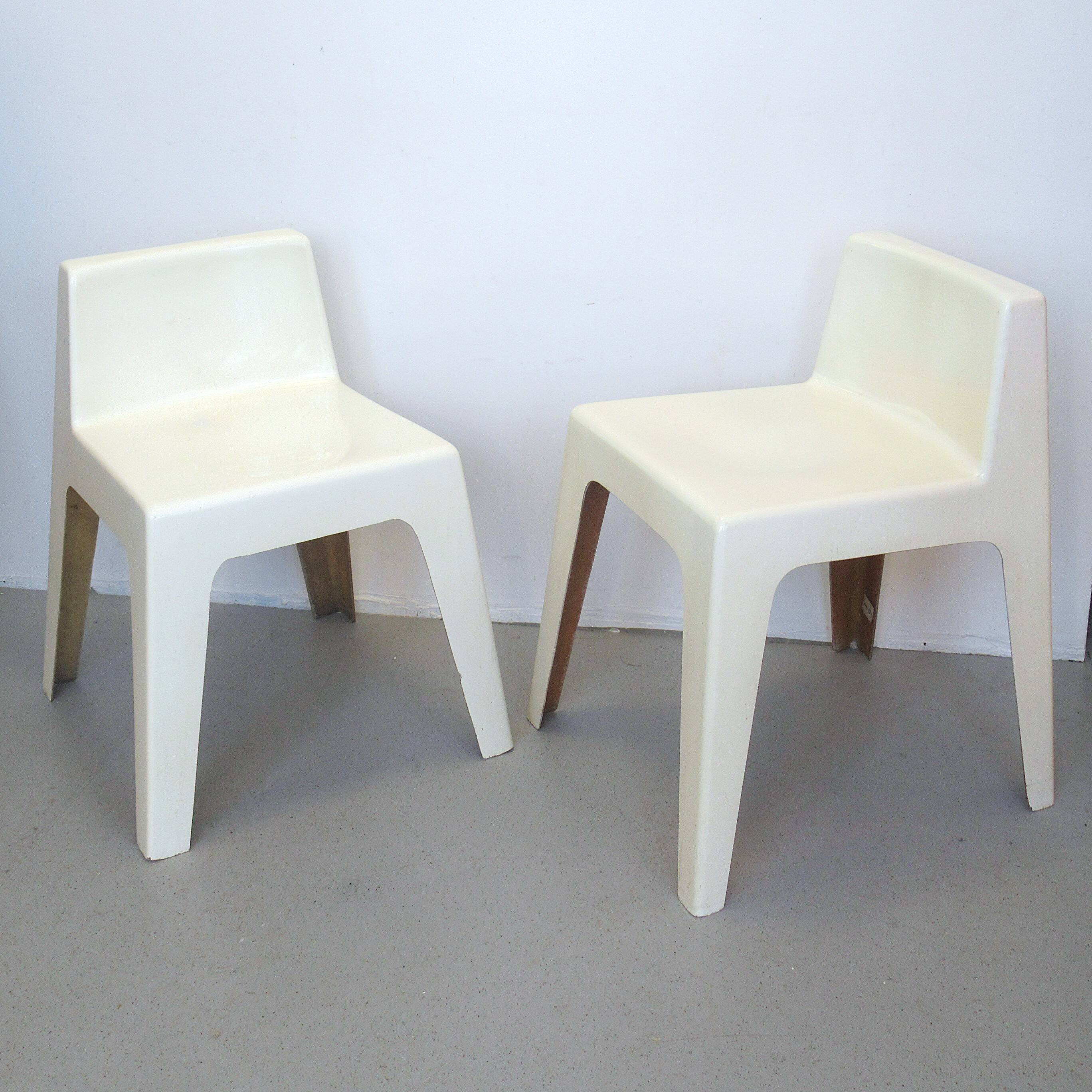 Two white fiberglass Kostka chairs 1970