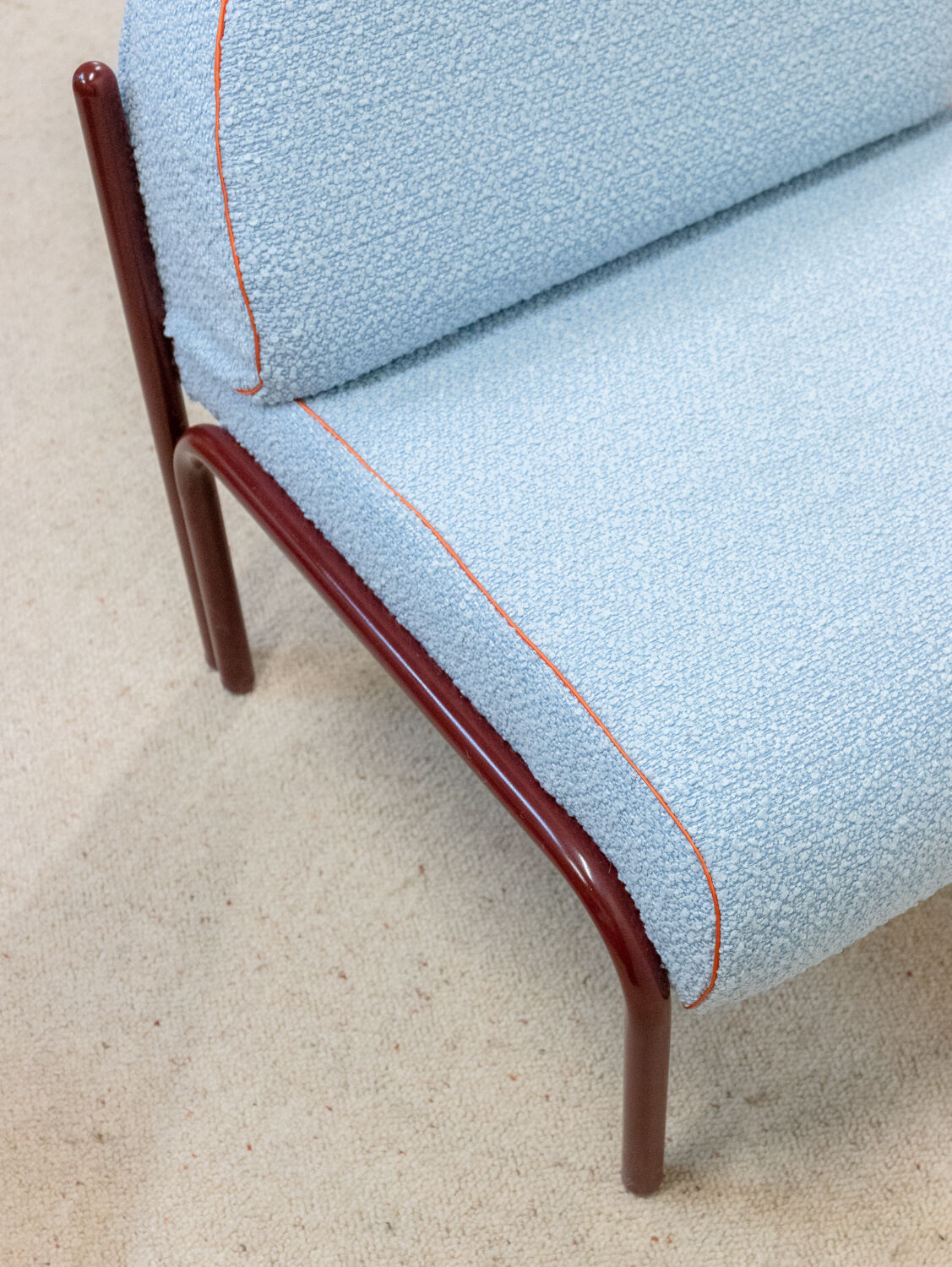 Souvignet armchair reupholstered in sky blue boucle.