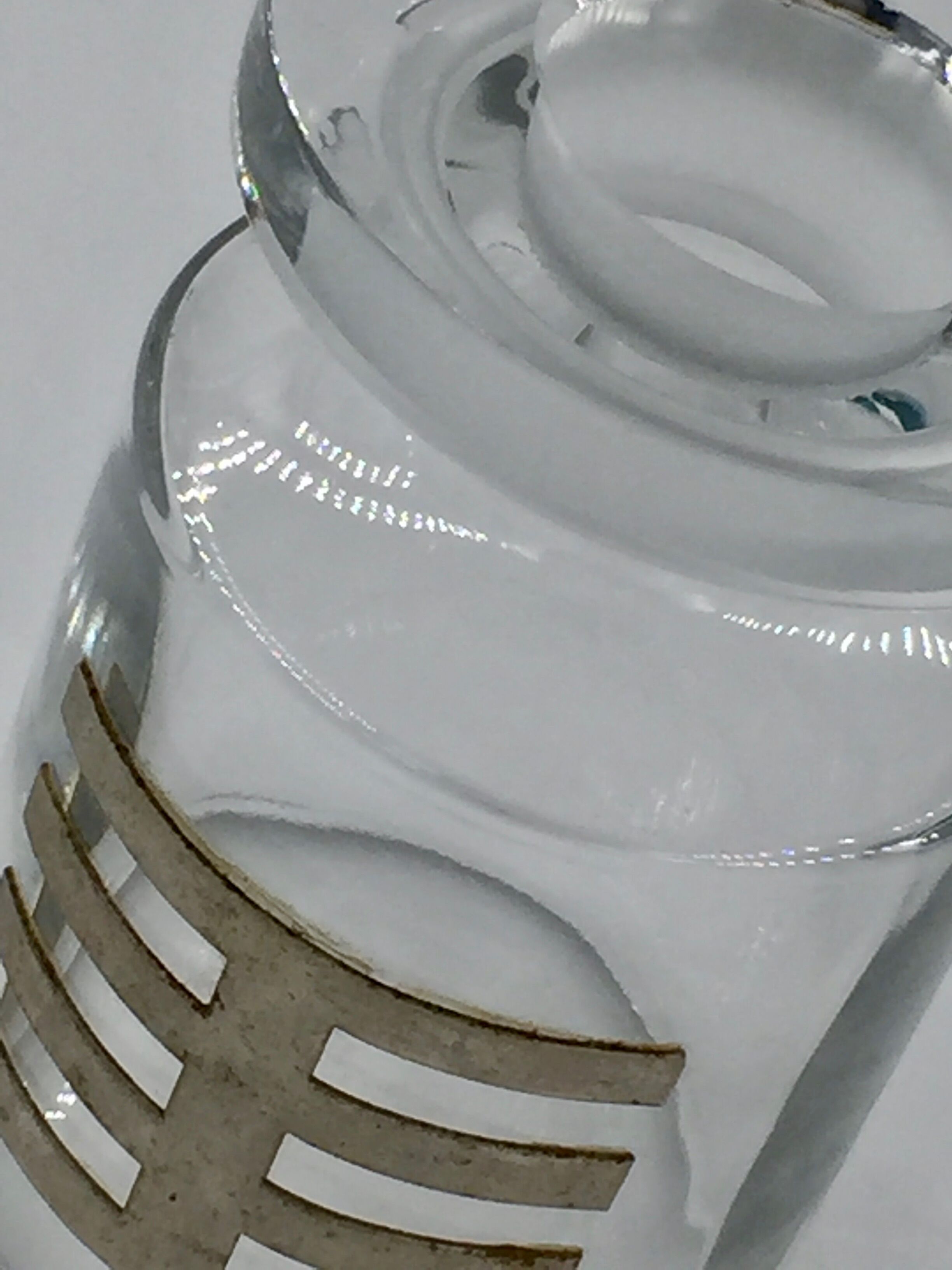 Two vintage 70s glass and metal bottles