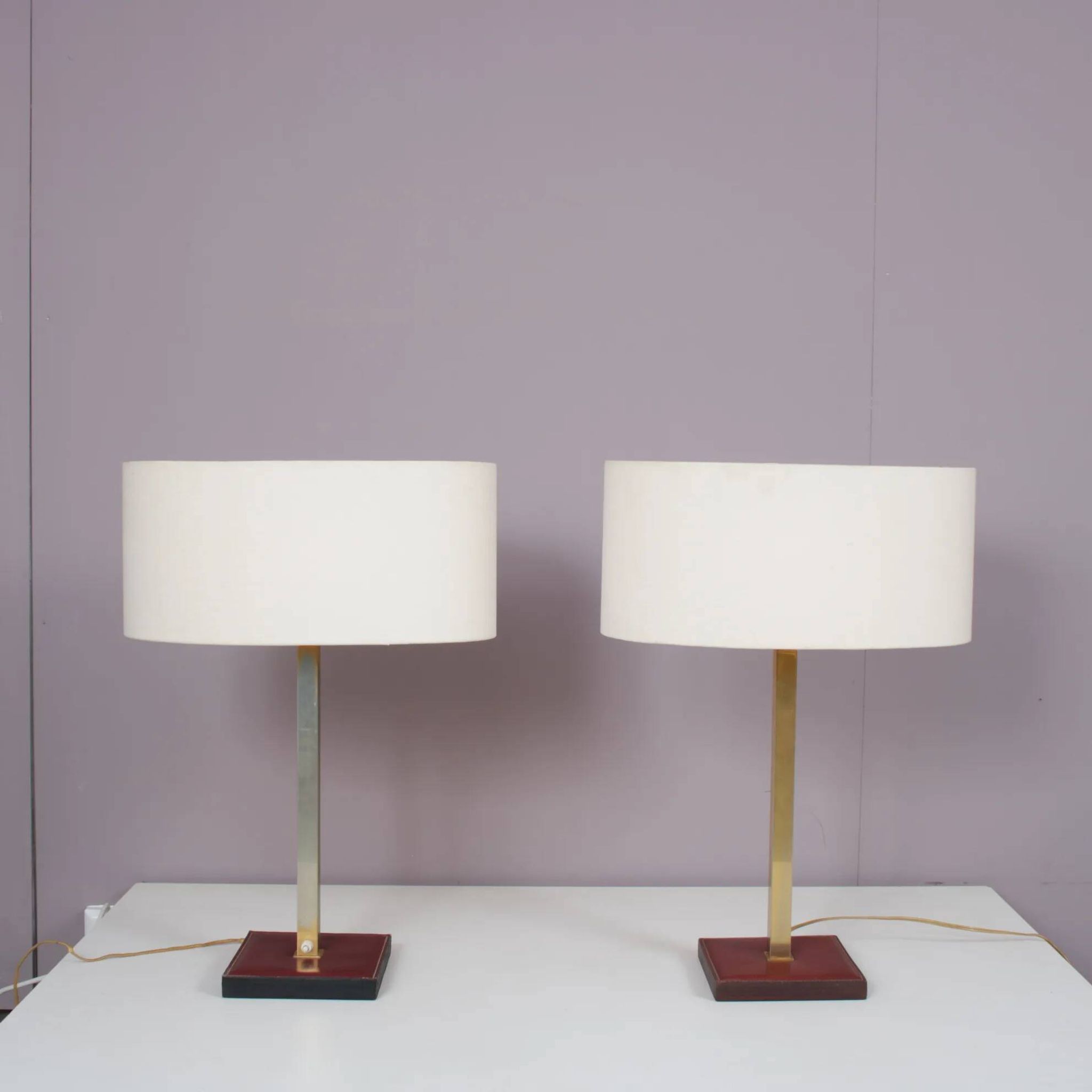 Pair of leather and brass table lamps from the 1960s, originating from Belgium.