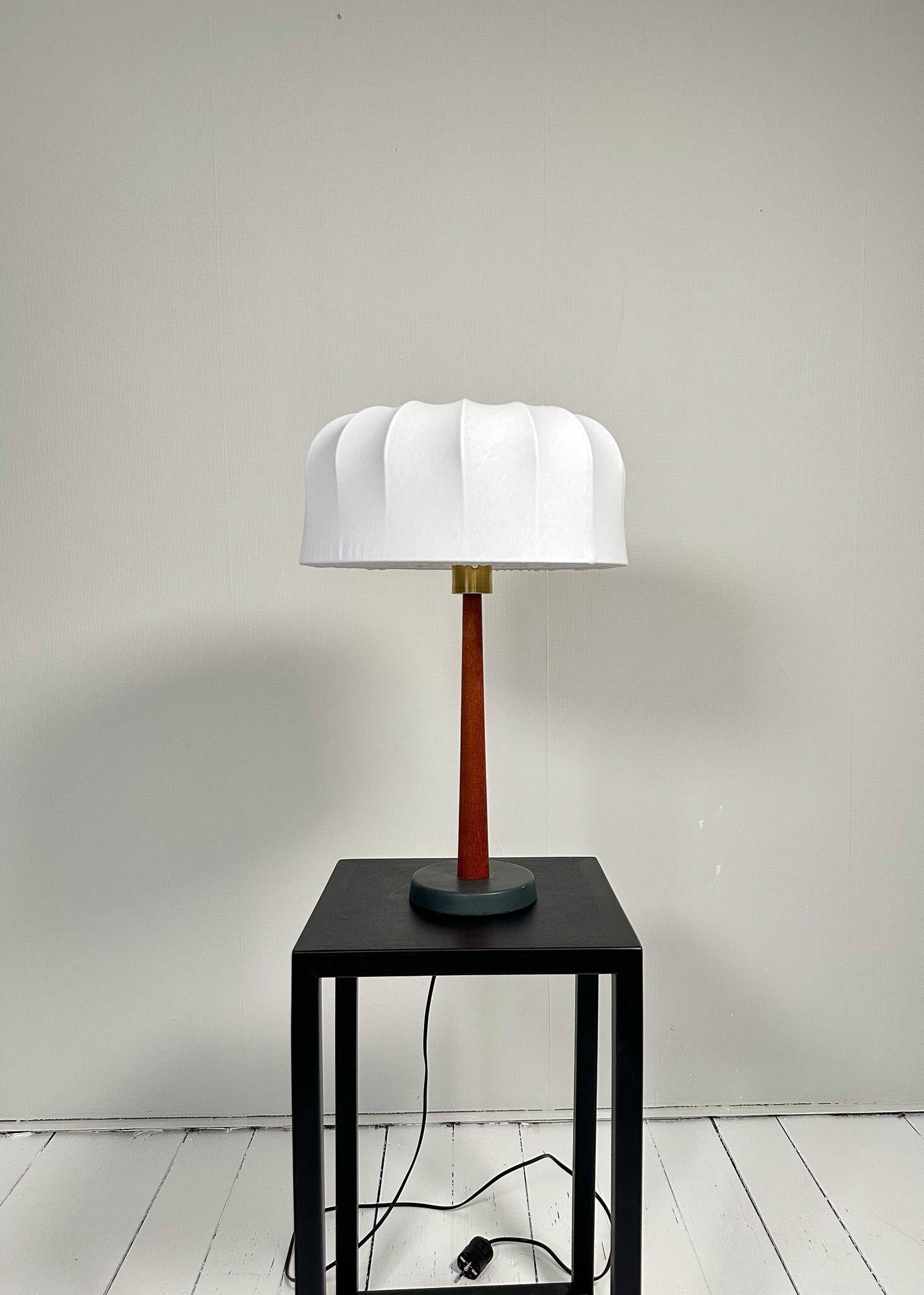 Mid-century teak and cotton table lamp by Einar Bäckström, Sweden, 1950s.