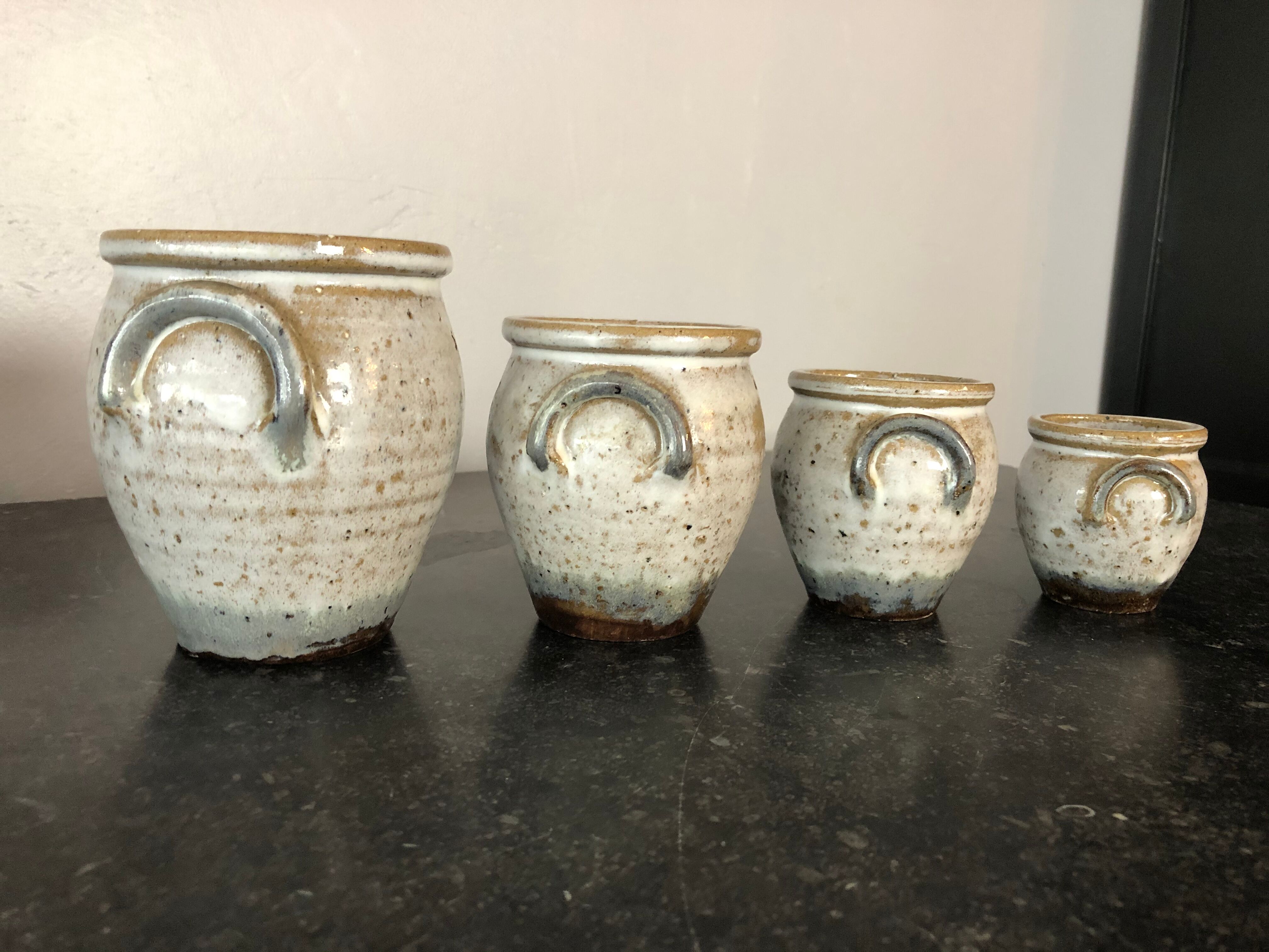 Set of 4 enamelled sandstone pots