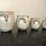 Set of 4 enamelled sandstone pots