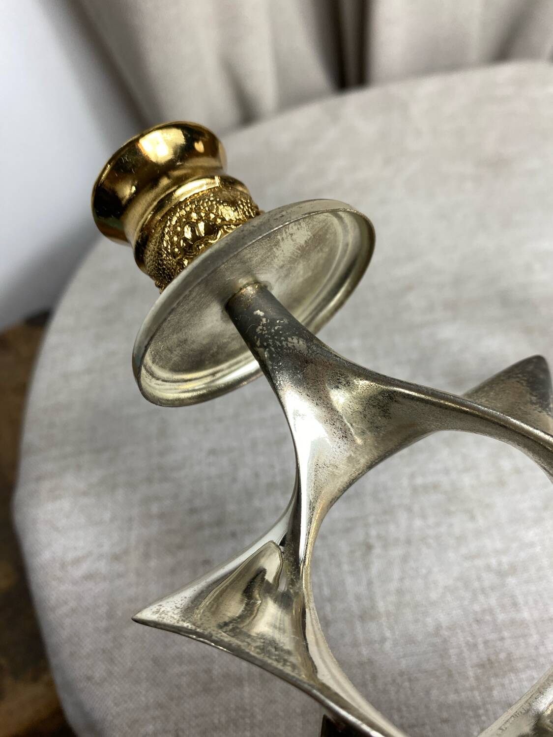 Pair of silver and gold metal candlesticks