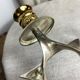 Pair of silver and gold metal candlesticks