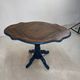 Wooden gueridon with a violin-shaped top in Rio rosewood, central base resting on four legs, reinterpreted in Baltic blue.