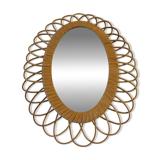 Vintage oval rattan mirror from the 60s and 70s with a rosette