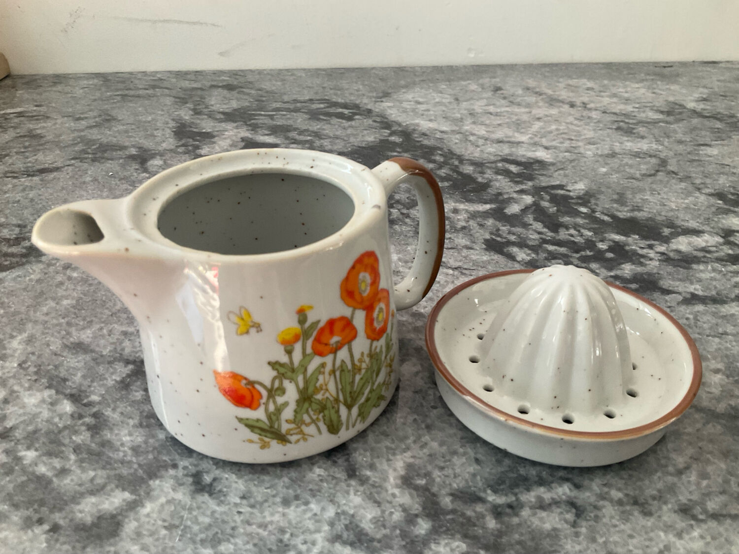 Vintage stoneware jug and its citrus juicer.