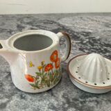 Vintage stoneware jug and its citrus juicer.