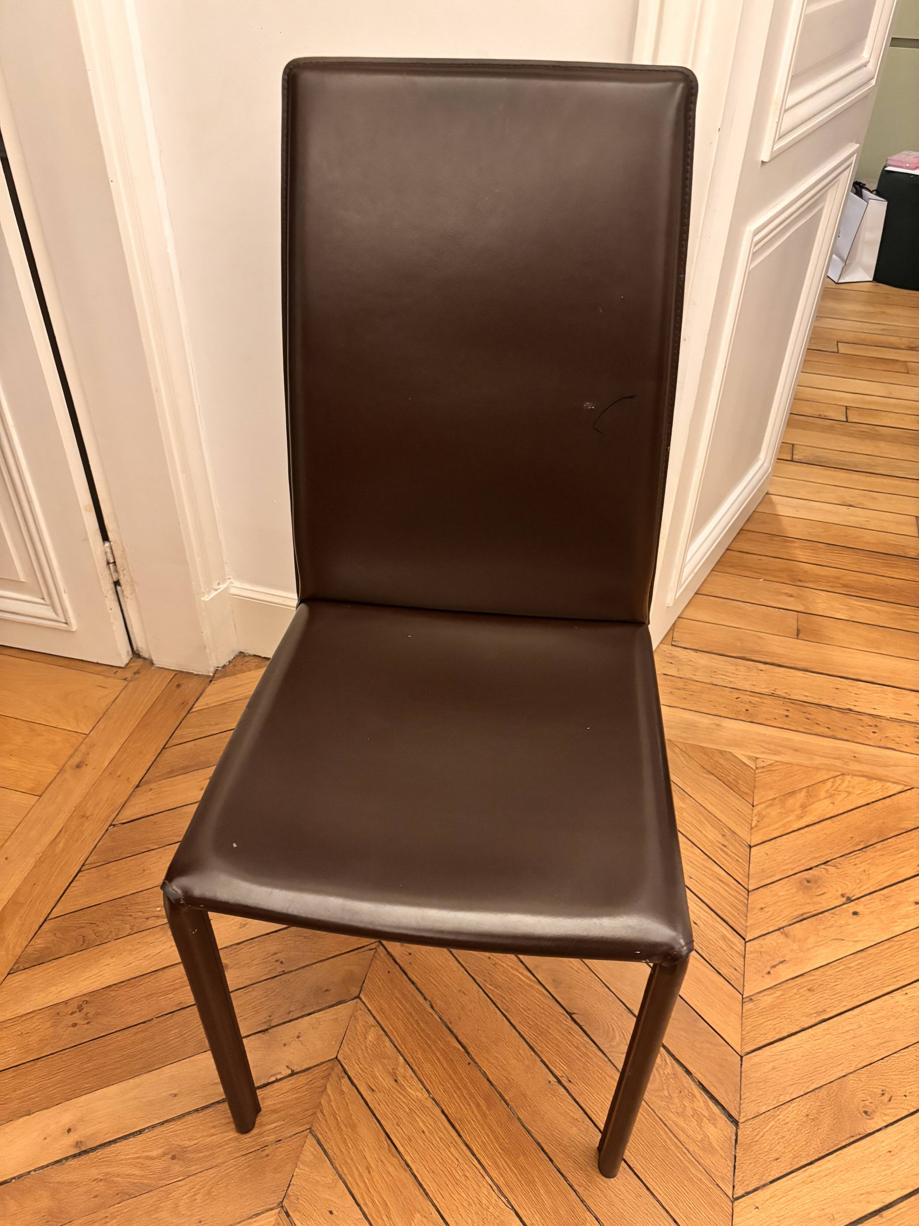 Many brown leather chairs "Roche Bobois"