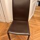 Many brown leather chairs "Roche Bobois"