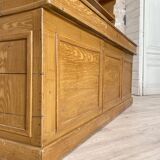 Wooden hardware cabinet painted with wood effect, circa 1940.