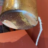 "Stoneware Bottle Lamp" with a multicoloured blue lampshade handwoven in India.