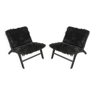 Pair of low chairs by olivier de schrijver
