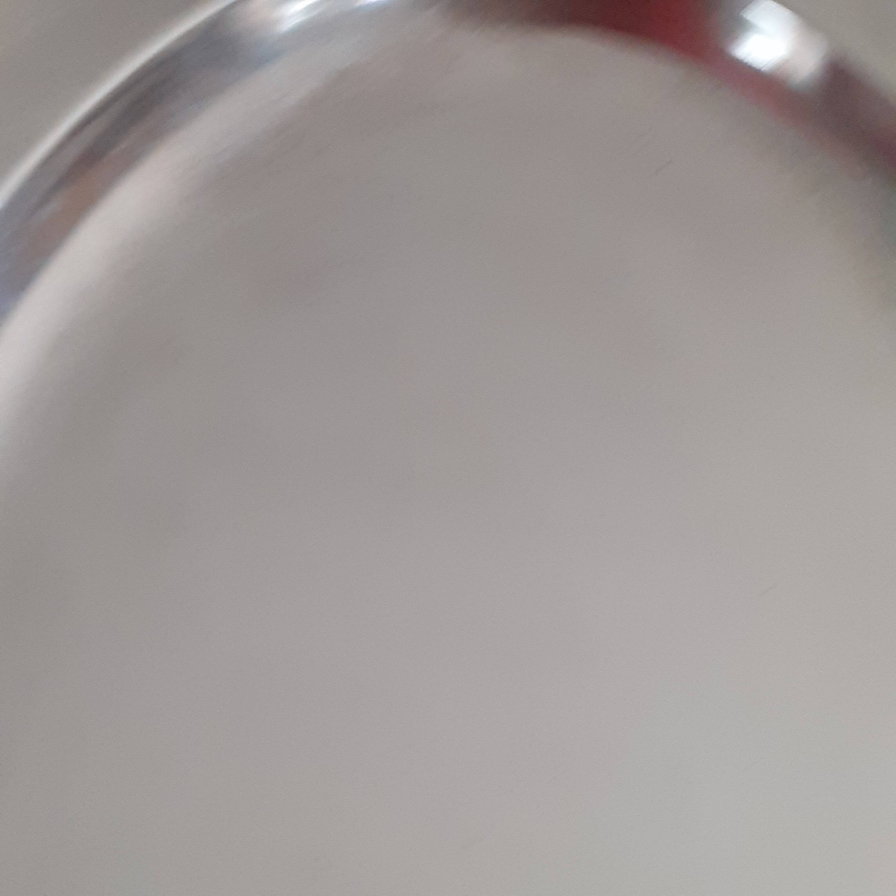 Oval silver metal dish. With initials.