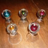 5 small glasses with colored bubble inclusions