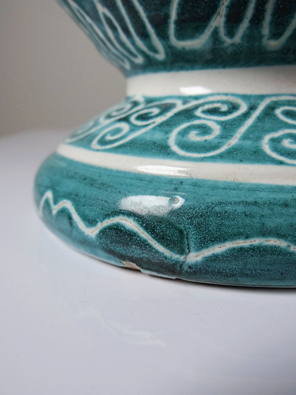 Vintage turquoise ceramic baluster vase with incised decoration.