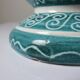 Vintage turquoise ceramic baluster vase with incised decoration.