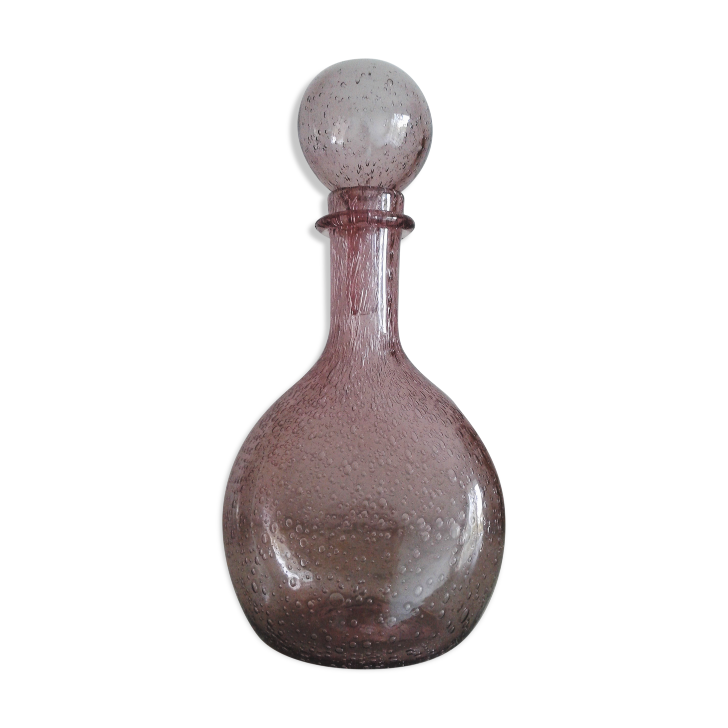 A bolted glass carafe