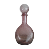 A bolted glass carafe