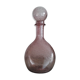 A bolted glass carafe