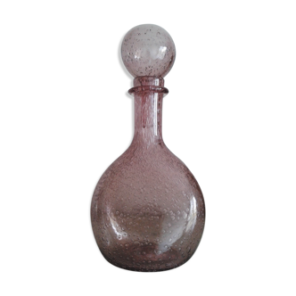 A bolted glass carafe