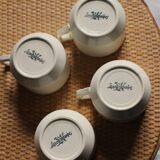 A set of 4 Sarreguemines ecru and gold earthenware cups