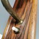 Small, stylish wall lamp with rosewood suspension and hard pressed glass