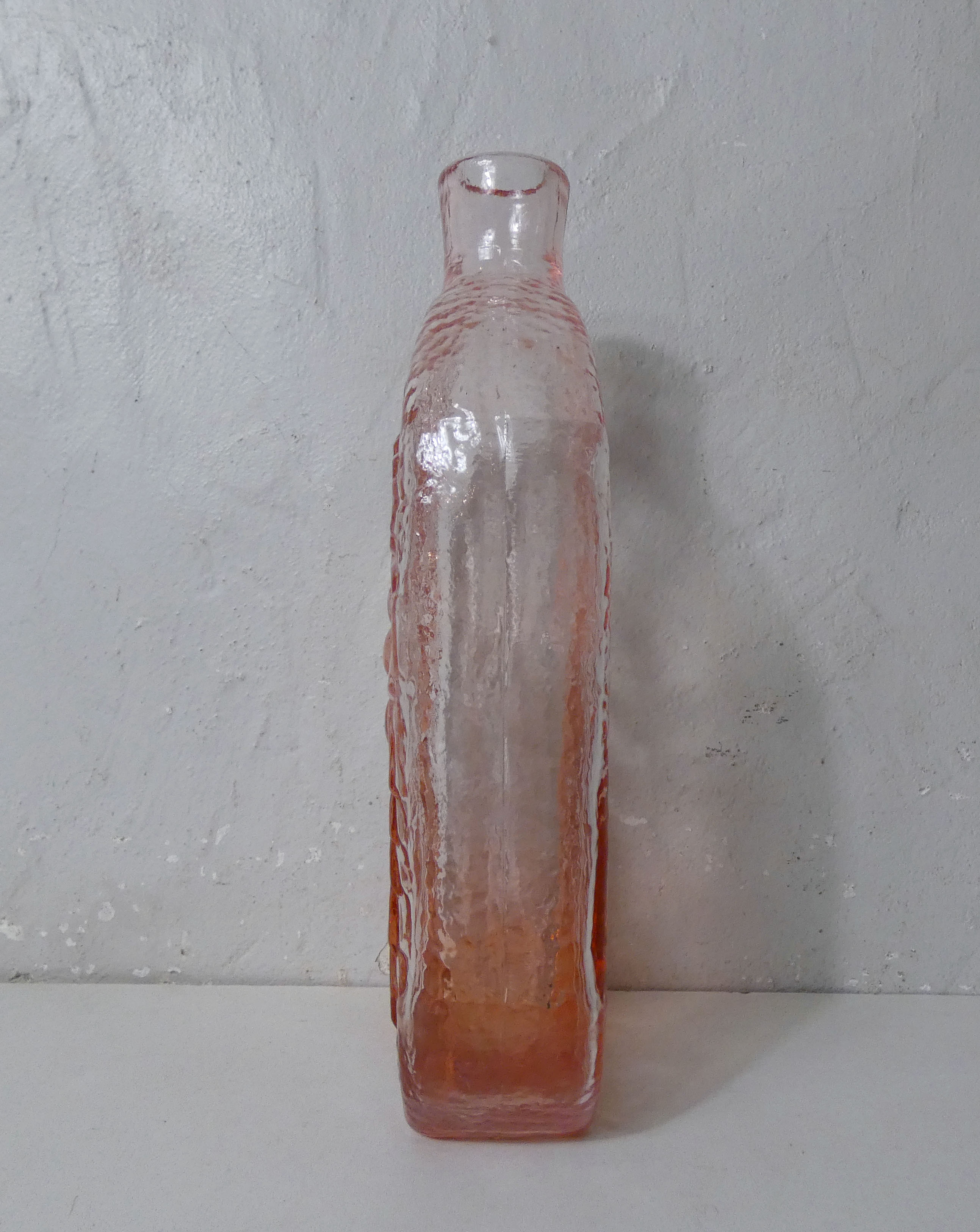 old carafe in orange pink glass