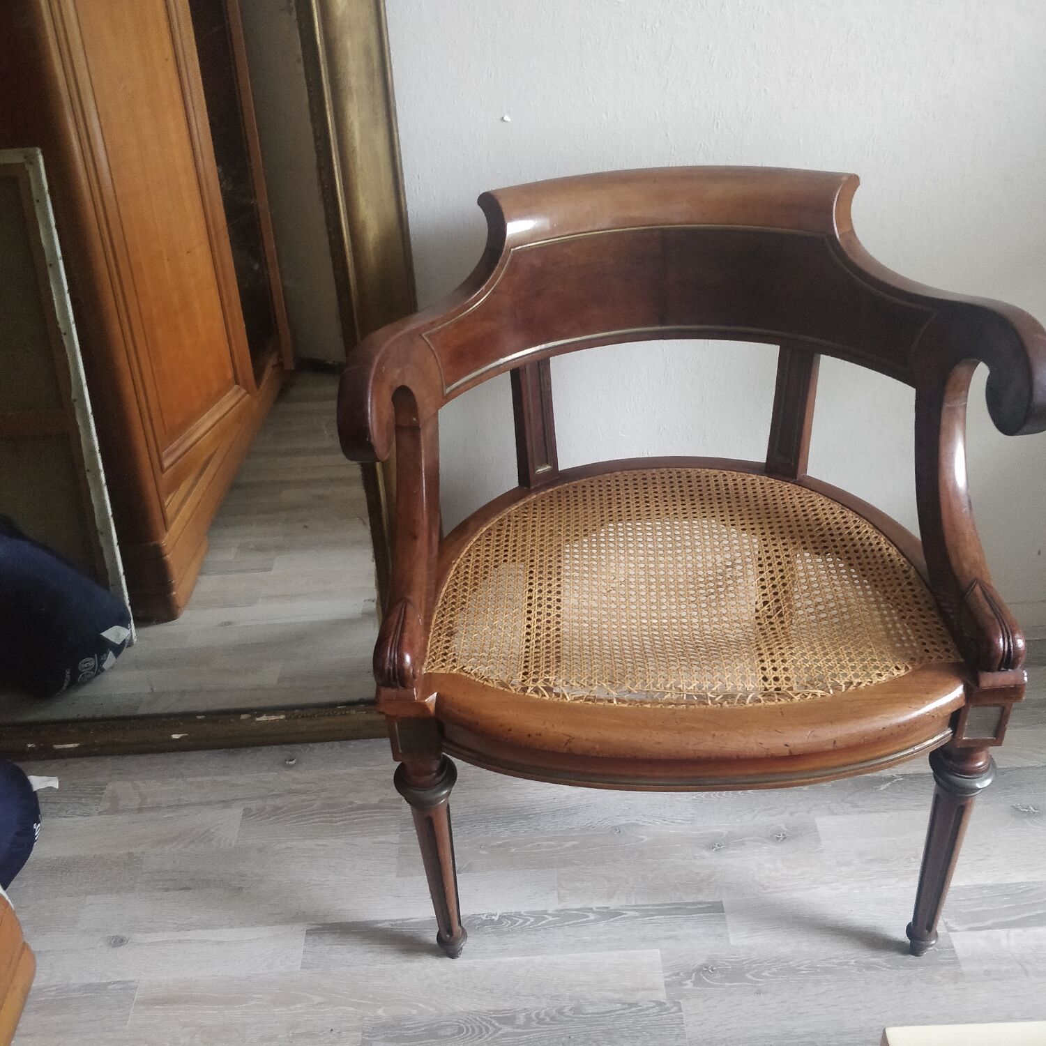 Armchair with canework and bronze detail