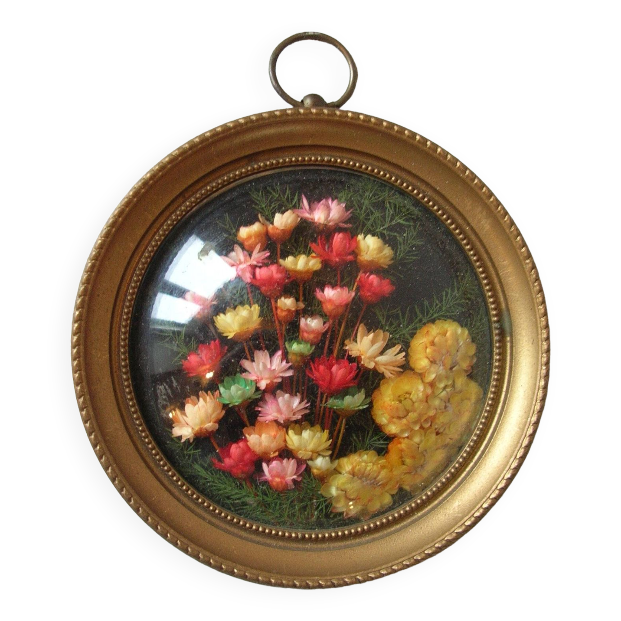 Old medallion frame bouquet of dried flowers glass and plastic retro decoration