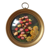 Old medallion frame bouquet of dried flowers glass and plastic retro decoration