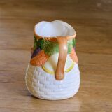 Hand-painted earthenware carafe with a raised vegetable basket design