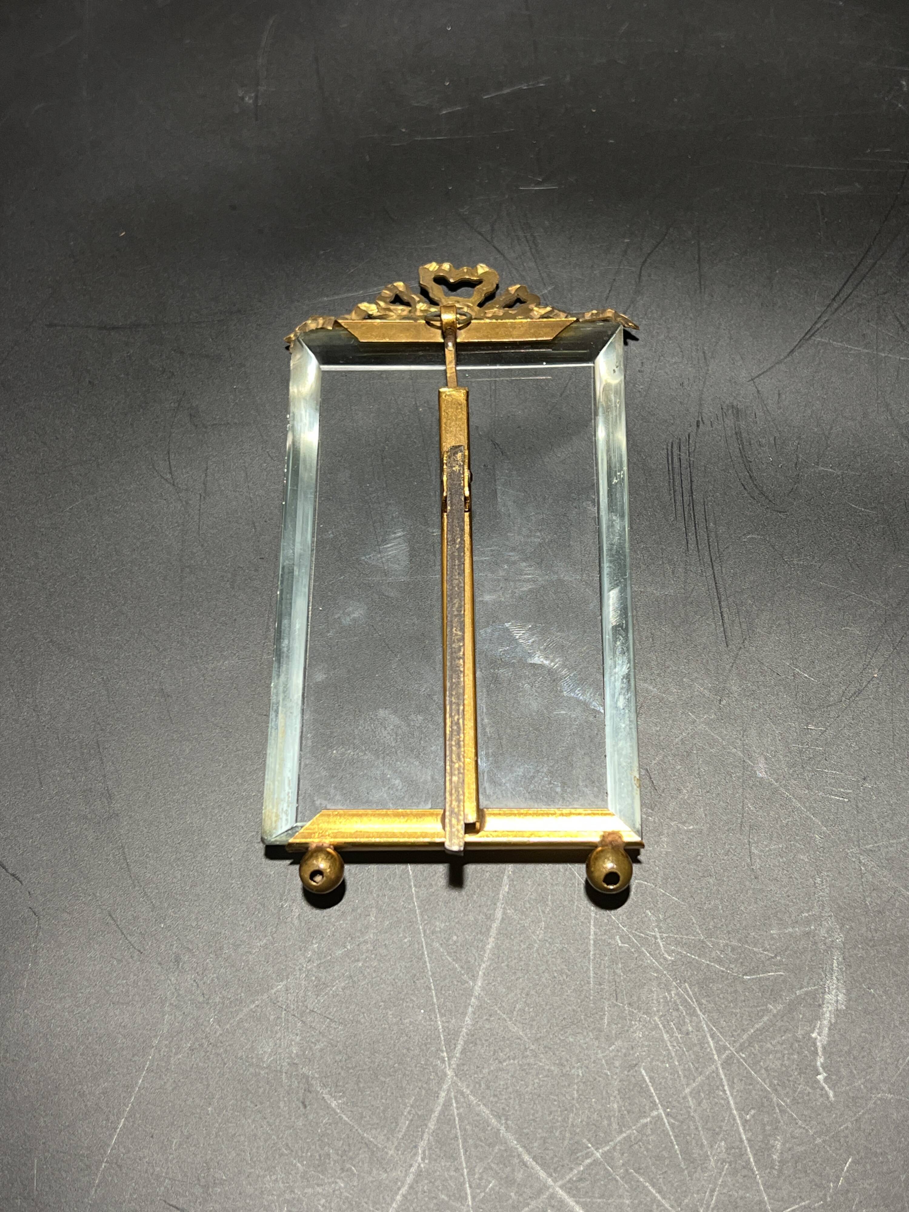 Glass and metal frame
