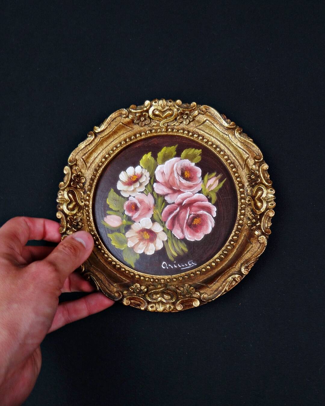 Still life in Tondo oil on panel of a bouquet of pink roses signed