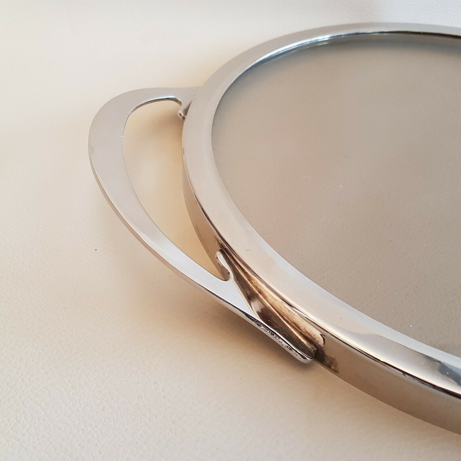 Round glass and art deco silver metal tray