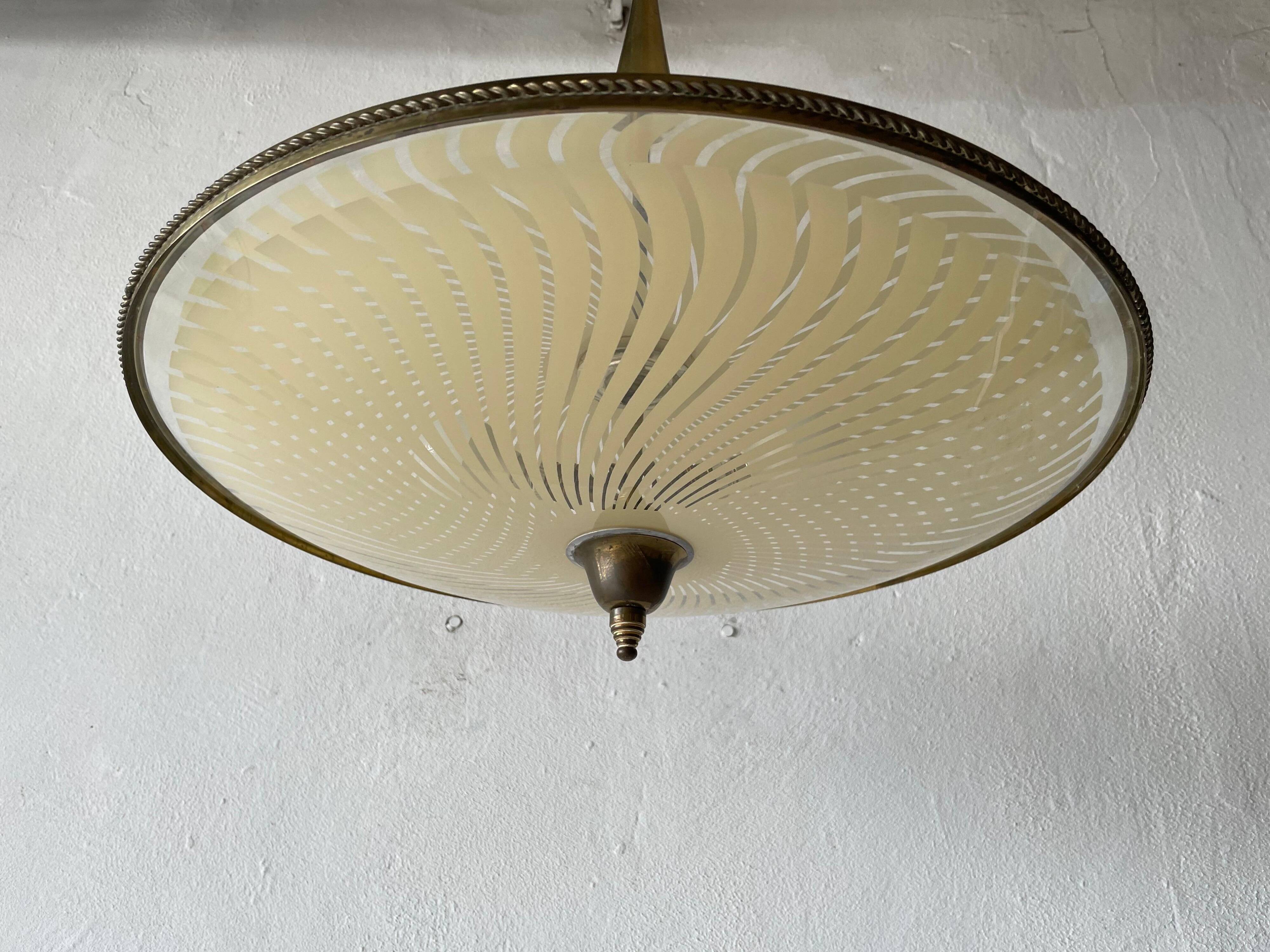 Large UFO design ceiling light in brass and printed glass, 1950s, Italy.