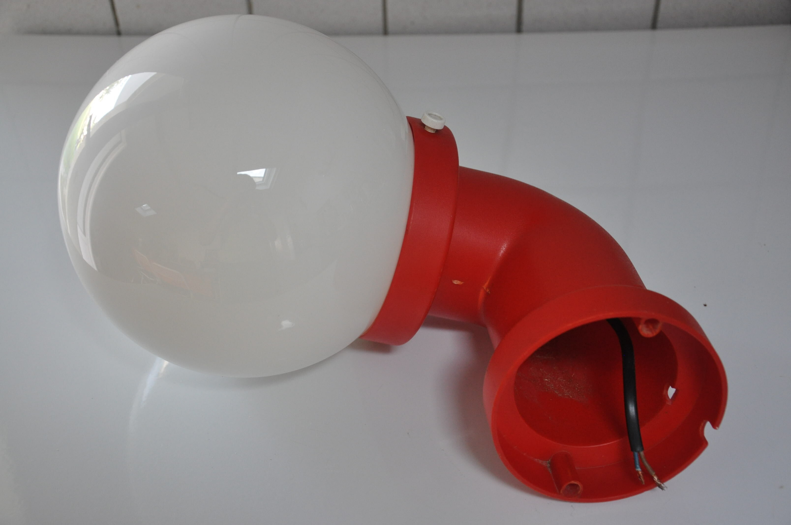 Danish wall light design indus red pipe