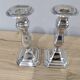 Pair of silver metal candle holders
