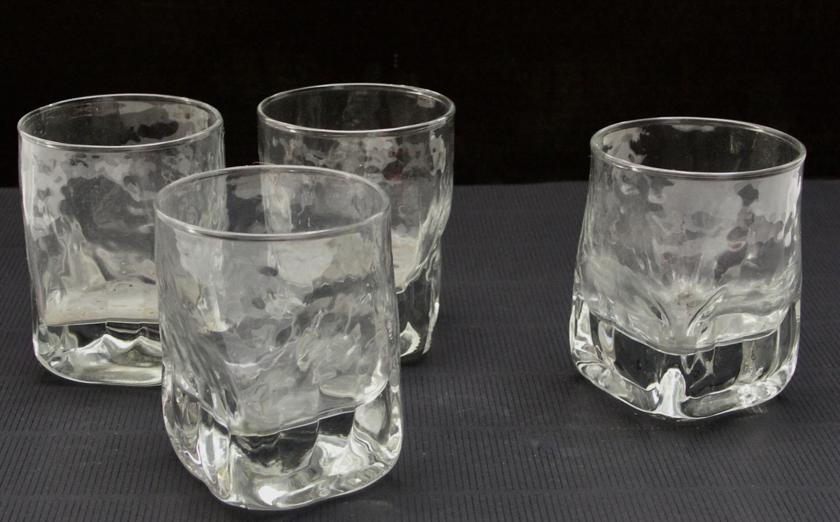 Four whisky glasses