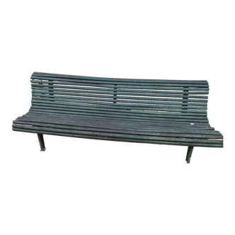 Wooden and cast iron bench old green garden