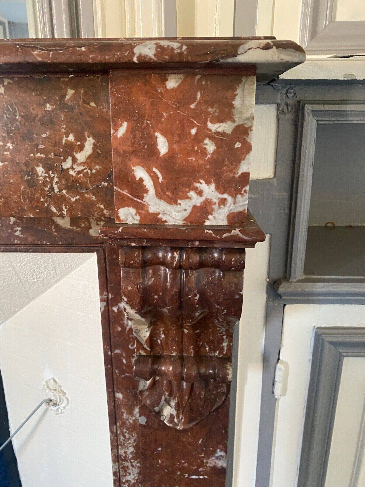 Louis Philippe style fireplace in speckled red marble 20th century