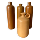 Suite de 4 bouteilles en grès