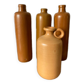Suite de 4 bouteilles en grès