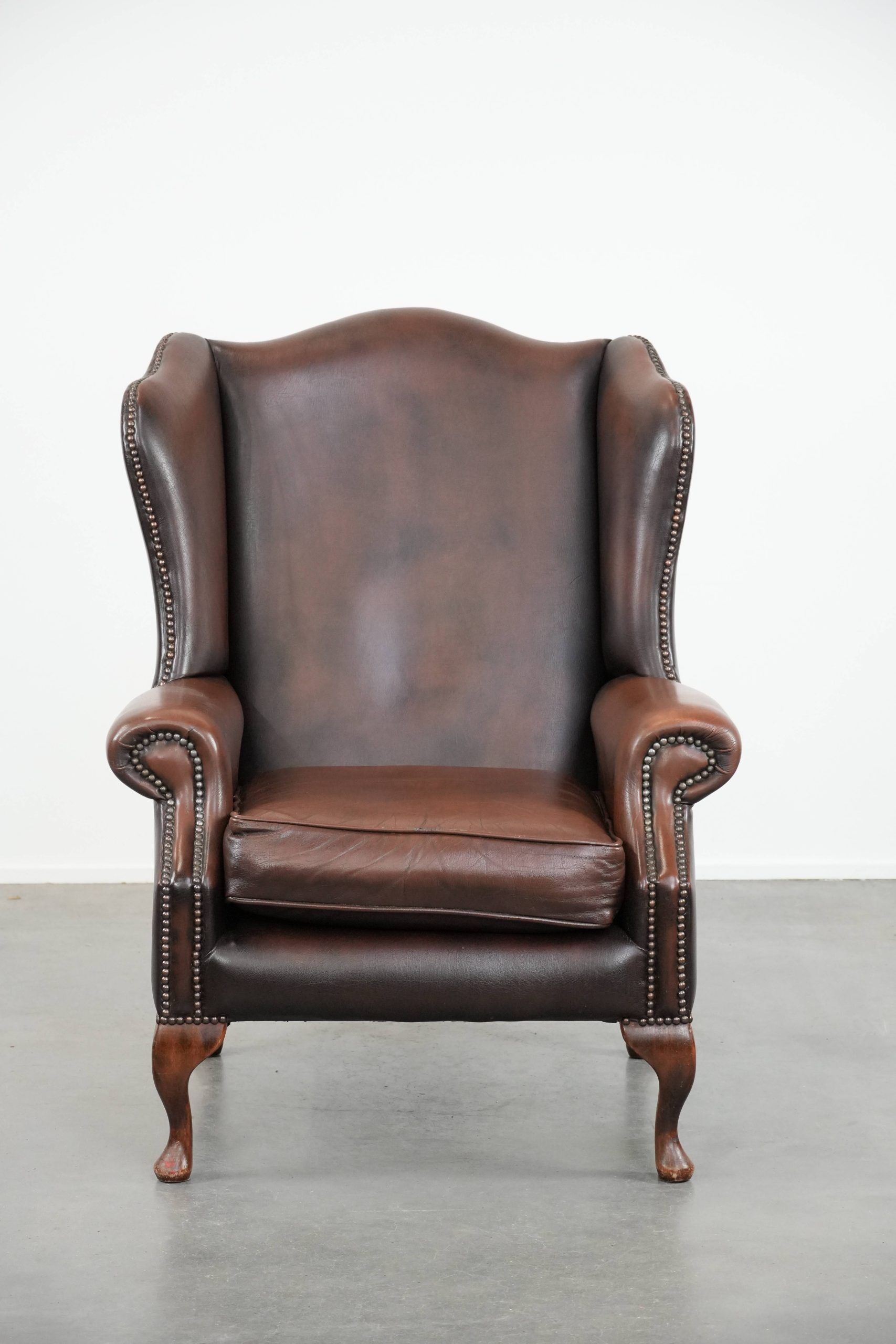 Brown smooth cow leather Chesterfield wingback armchair in English style