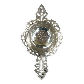 Antique tea strainer in solid silver