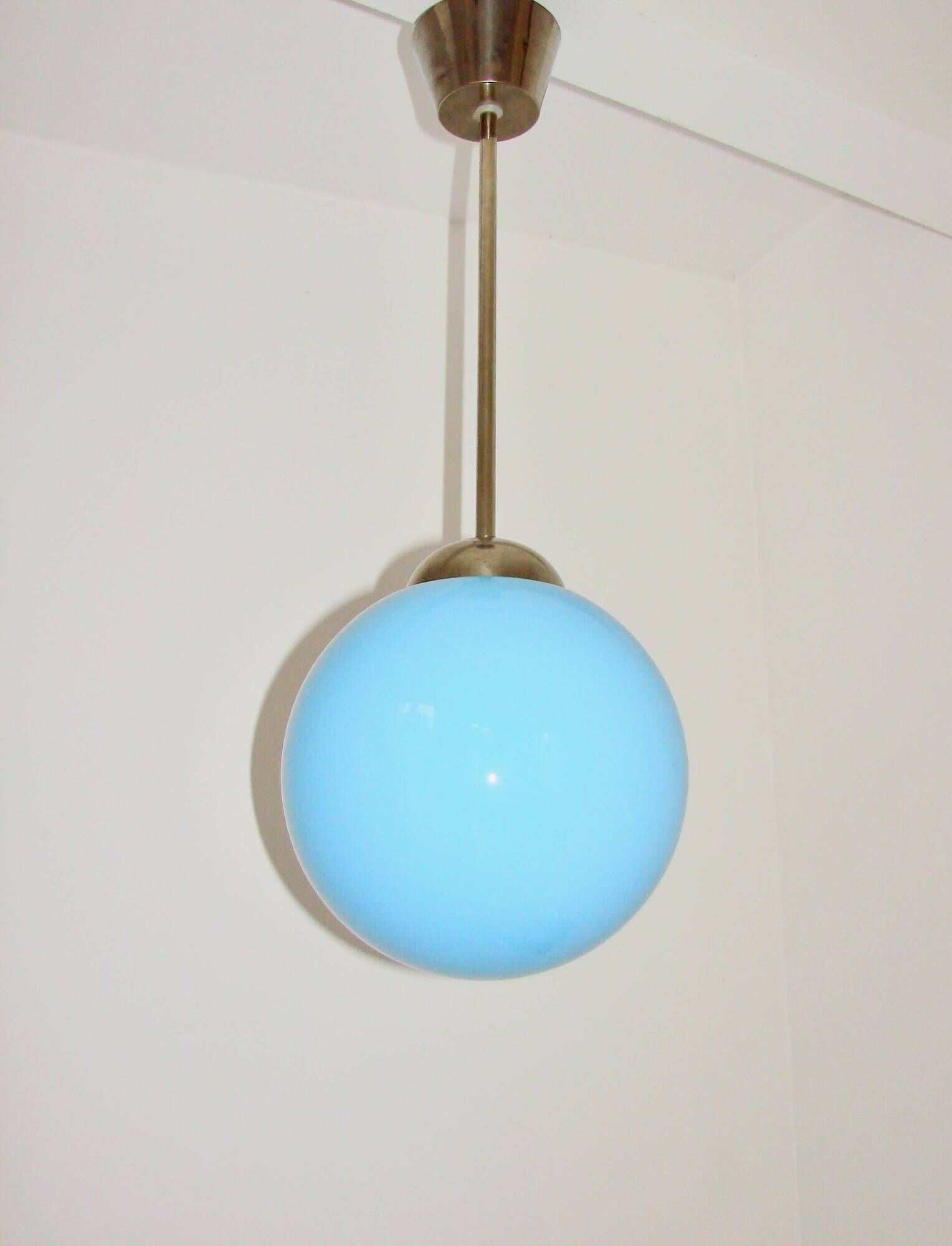 A pendant lamp with a blue glass shade, 1940s.